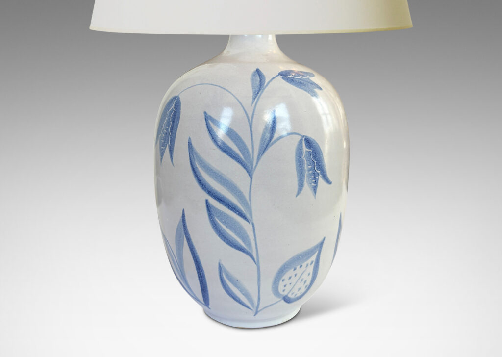 Gallery BAC ovoid form glazed in white with folk-style floral designs in light blue tones