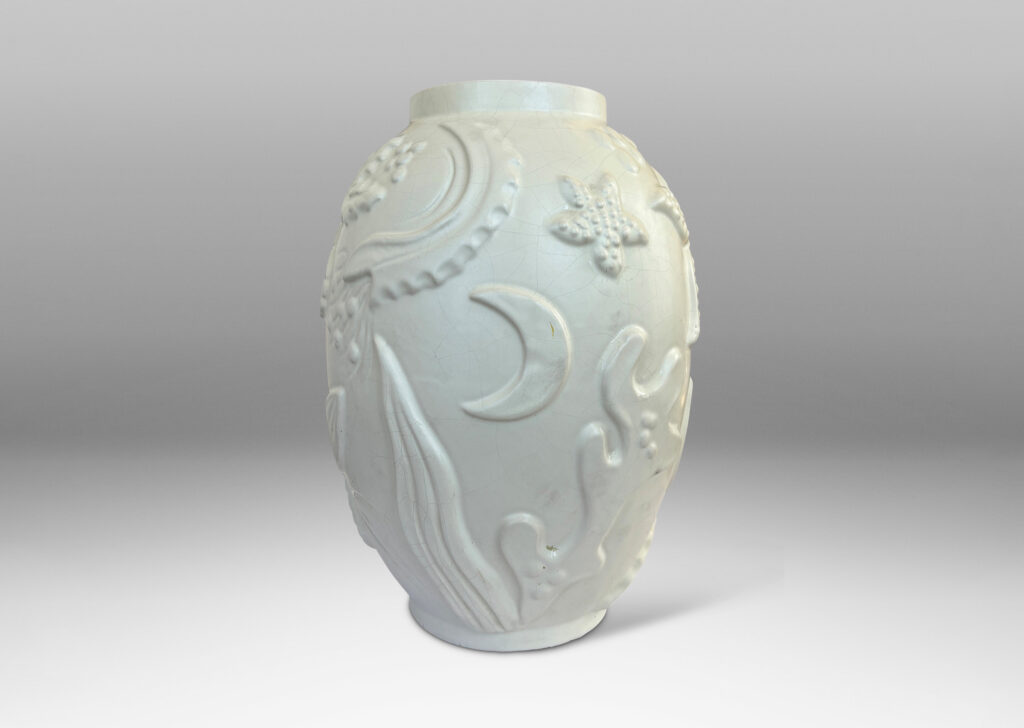 Gallery BAC void form with reliefs depicting marine flora and fauna in an eggshell finish warm ivory glaze