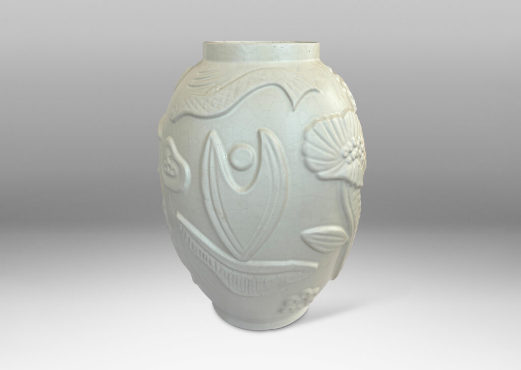 Gallery BAC void form with reliefs depicting marine flora and fauna in an eggshell finish warm ivory glaze