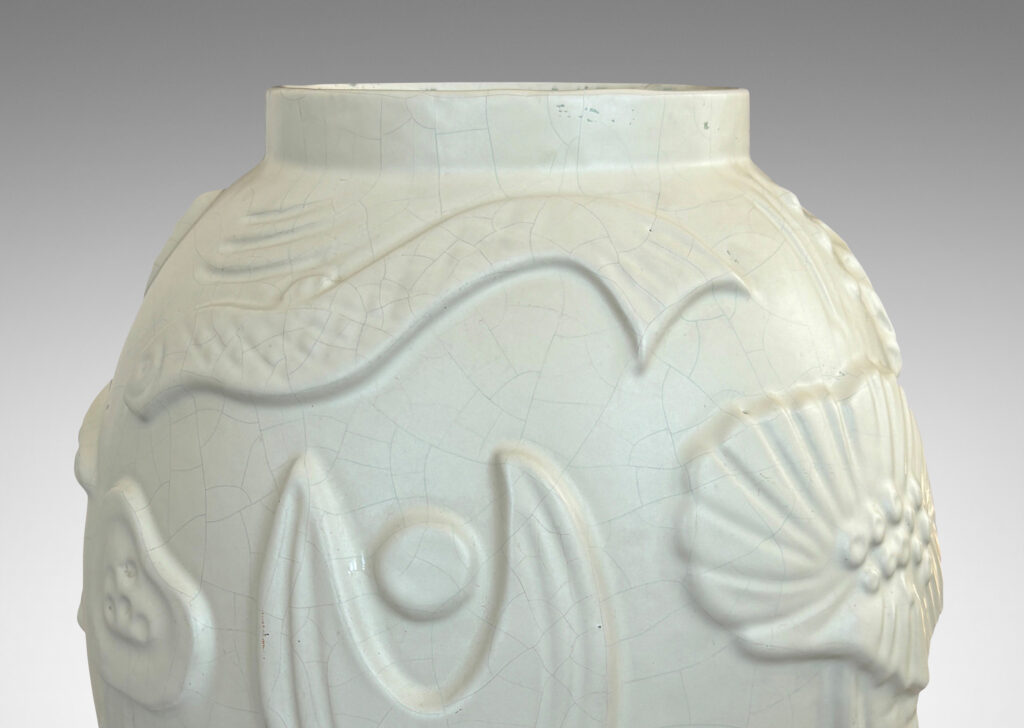 Gallery BAC void form with reliefs depicting marine flora and fauna in an eggshell finish warm ivory glaze