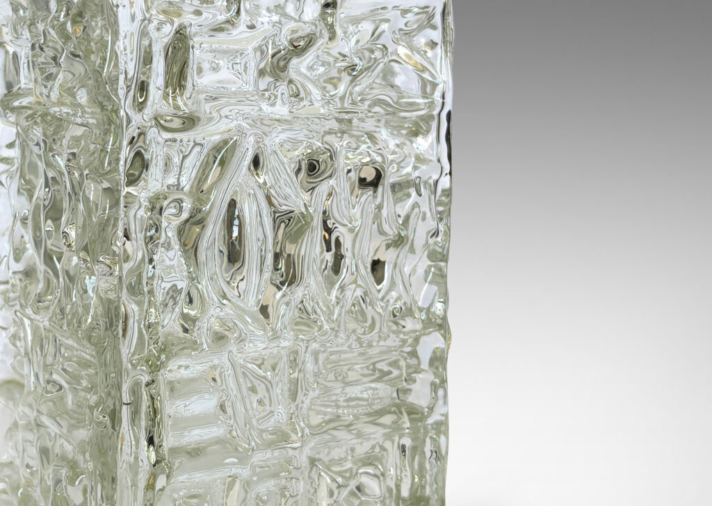 Gallery BAC square canister forms with various geometric designs in reliefs; clear mold-blown glass