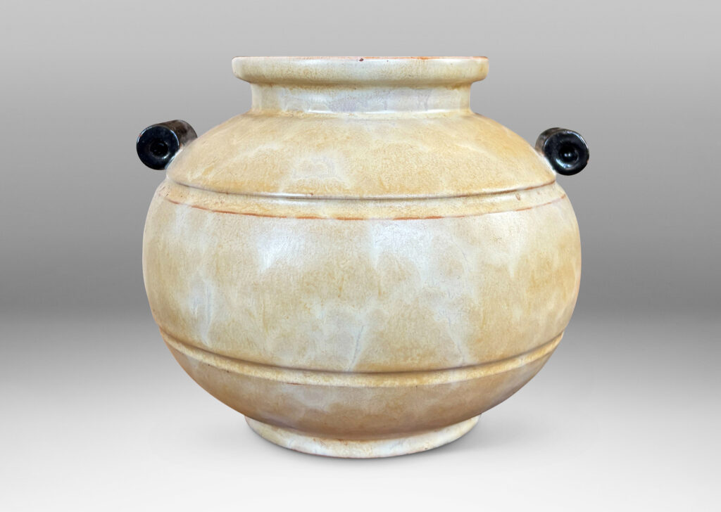 Gallery BAC very plump globe form with articulated mouth, carved bands and scroll handles, glazed in an ethereal butter yellow with black