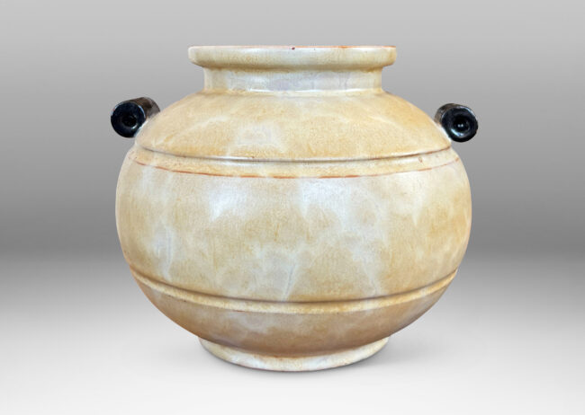 Gallery BAC very plump globe form with articulated mouth, carved bands and scroll handles, glazed in an ethereal butter yellow with black