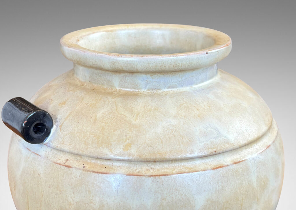 Gallery BAC very plump globe form with articulated mouth, carved bands and scroll handles, glazed in an ethereal butter yellow with black