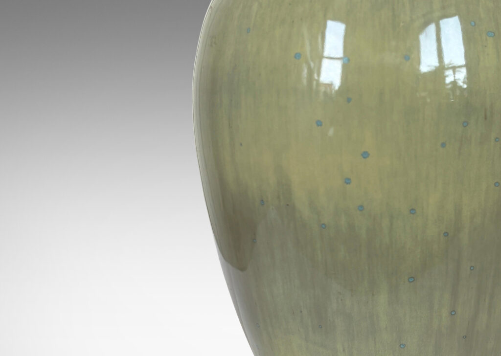Gallery BAC rounded tapering form with cove neck, glazed in an earthy pale yellow with gray undertones and light blue speckling