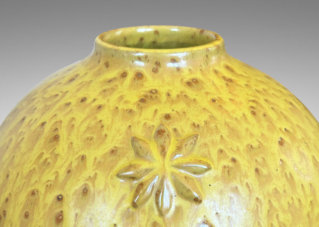 Gallery BAC large tapered globe form with floating star motifs, in a flowing yellow glaze with brown accents