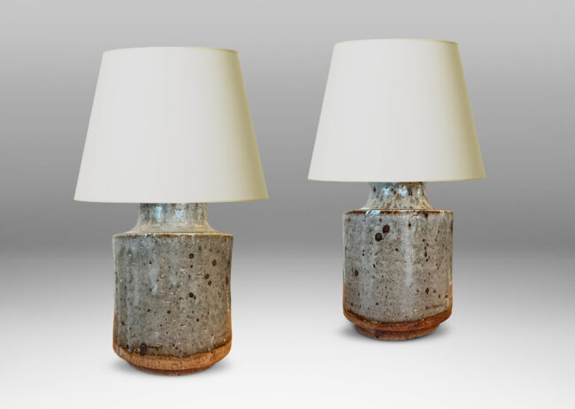 Gallery BAC cylindrical bodies with coved necks, glazed in a greenish pale gray with dark dappling