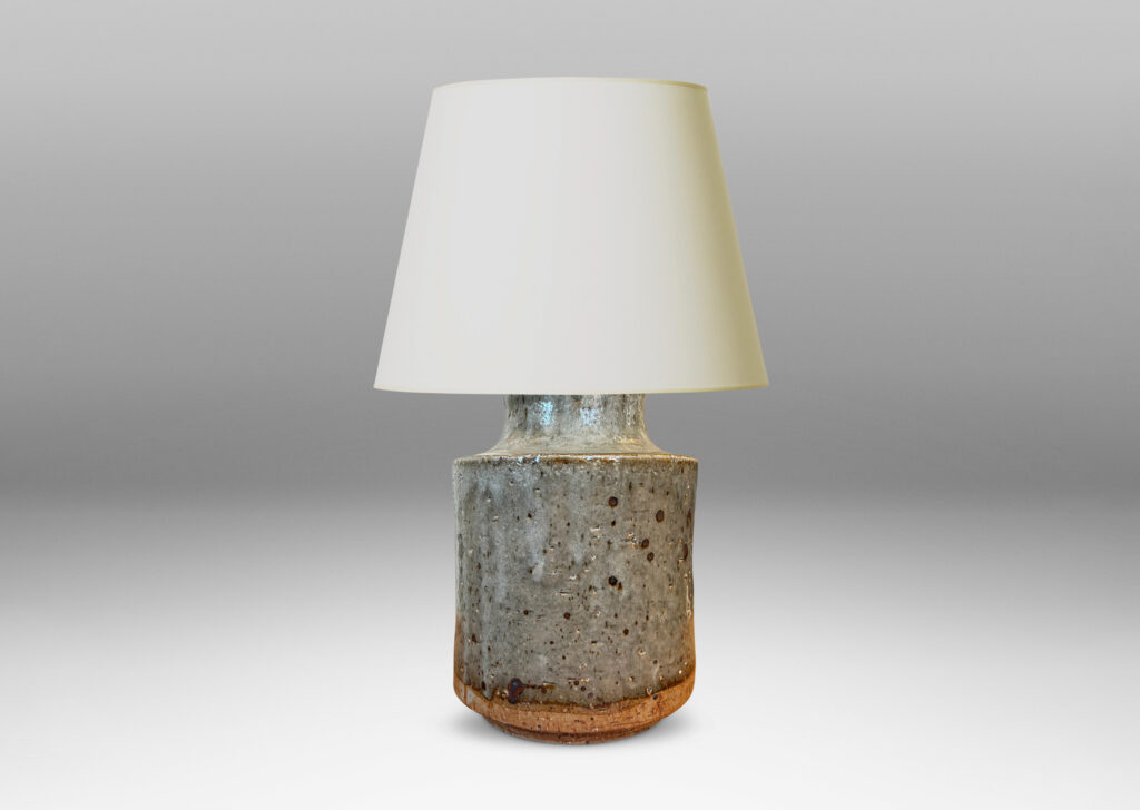 Gallery BAC cylindrical bodies with coved necks, glazed in a greenish pale gray with dark dappling