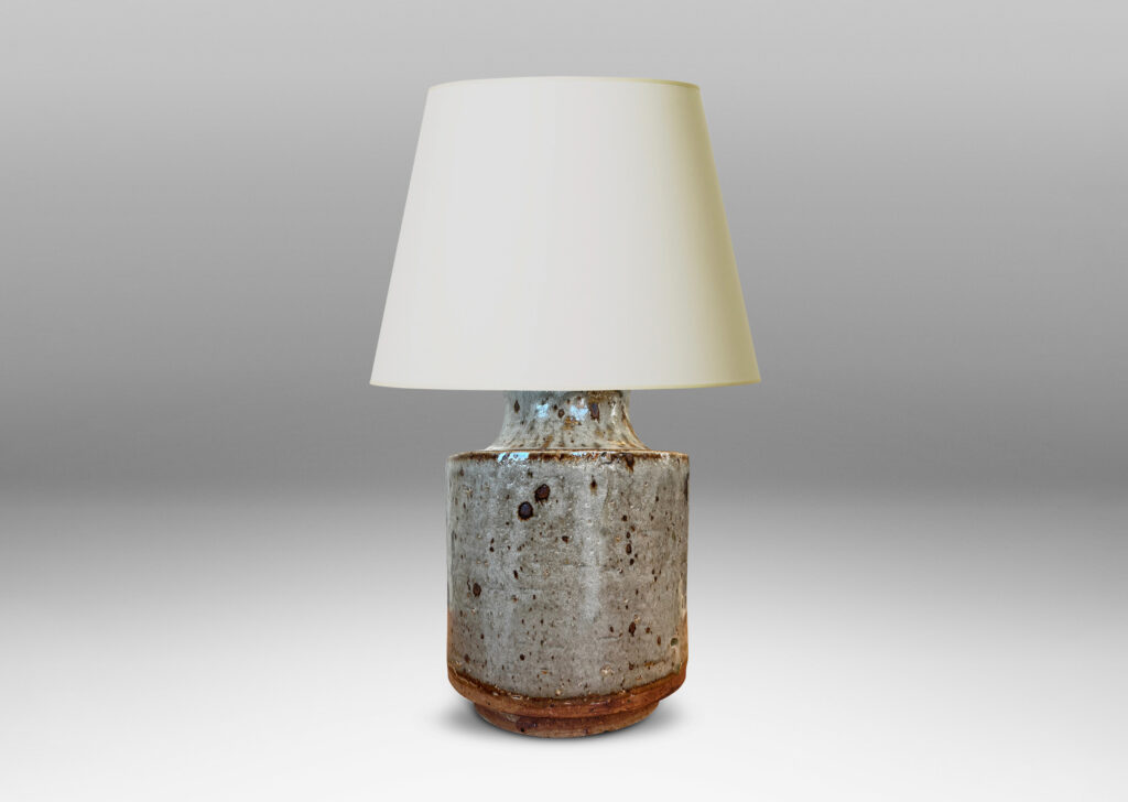 Gallery BAC cylindrical bodies with coved necks, glazed in a greenish pale gray with dark dappling