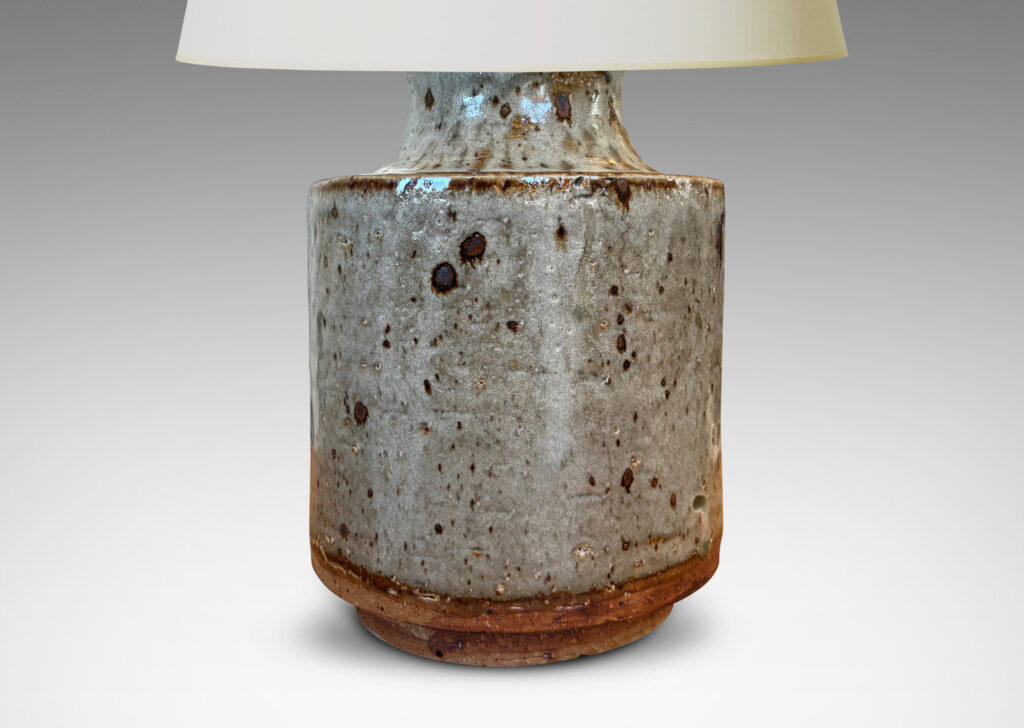 Gallery BAC cylindrical bodies with coved necks, glazed in a greenish pale gray with dark dappling