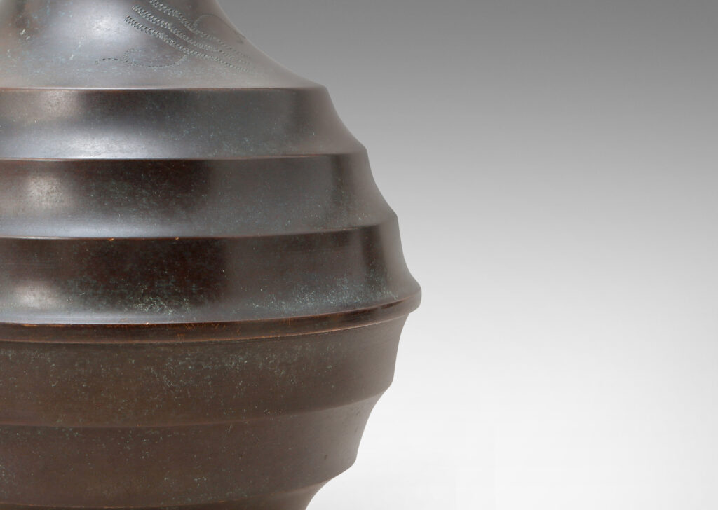 Gallery BAC globe form with horizontal fluting and engraved motif, with handsome original patination