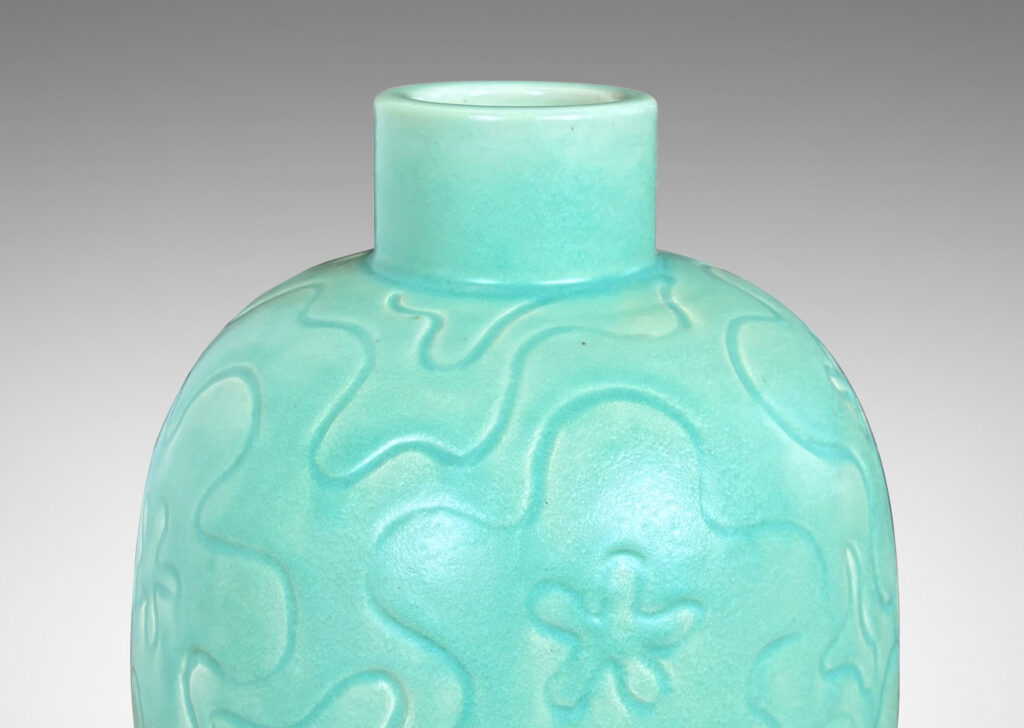 Gallery BAC large ovoid form with cheerful carved floral design, glazed in a bright celadon