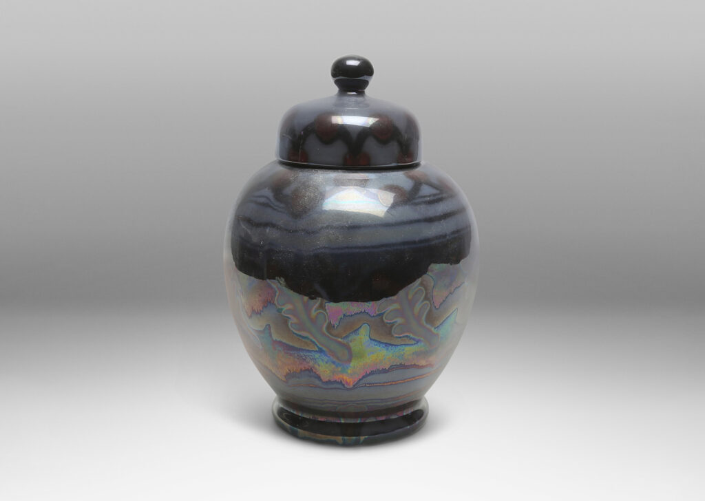 Gallery BAC tapered globe body with dome lid and ball finial, glazed in gray, purple and burgundy luster