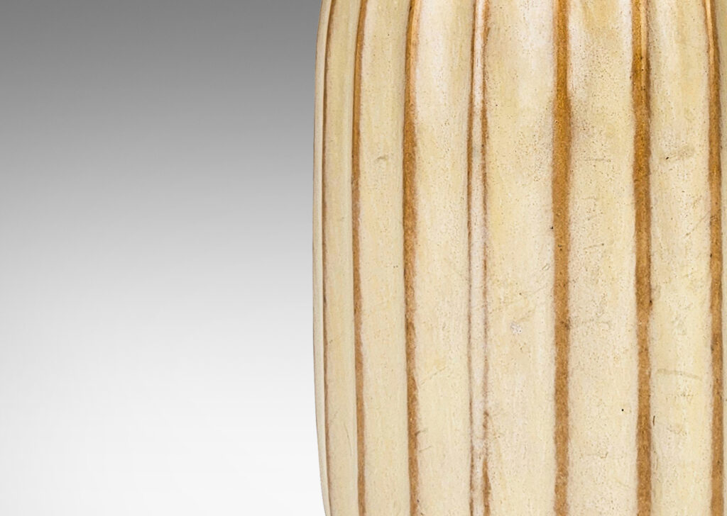 Gallery BAC straight-sided ovoid form with vertical fluting in a sponged pale green-cream glaze