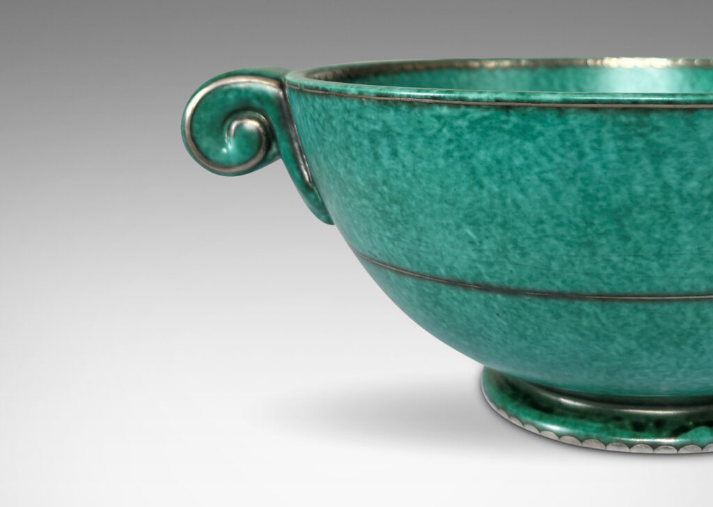 Gallery BAC demi-spherical form with scroll handles, finished in a mottled blue-green copper oxide glaze