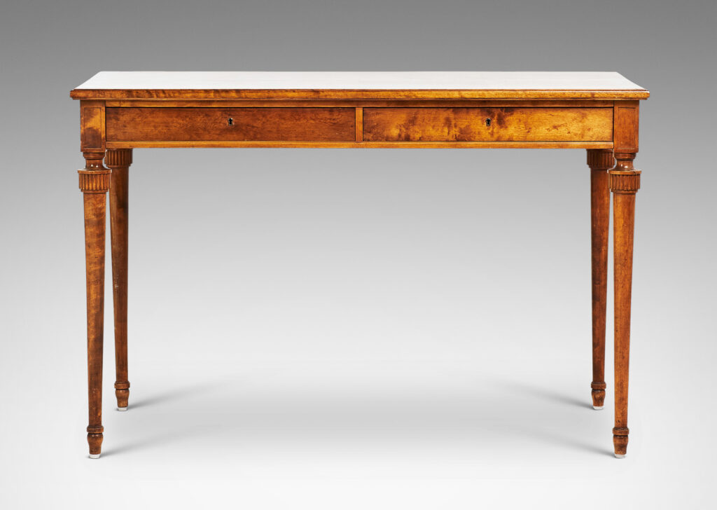 Gallery BAC rectangular top and case with two drawers and round tapered legs with stylized tassel headers