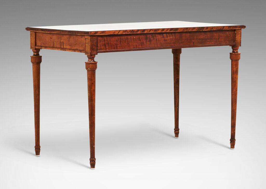 Gallery BAC rectangular top and case with two drawers and round tapered legs with stylized tassel headers