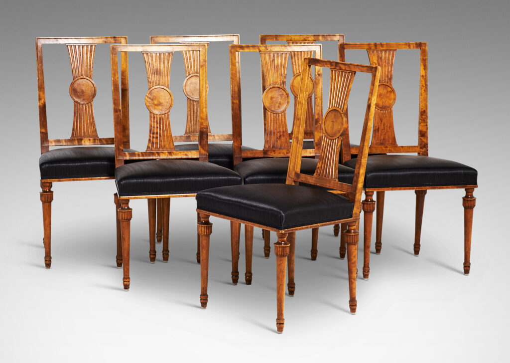Gallery BAC squared backs with splats ornamented with radiating fluting and central disk medallions, and tapered legs with stylized tassel headers