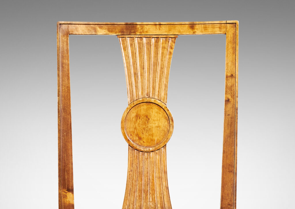 Gallery BAC squared backs with splats ornamented with radiating fluting and central disk medallions, and tapered legs with stylized tassel headers