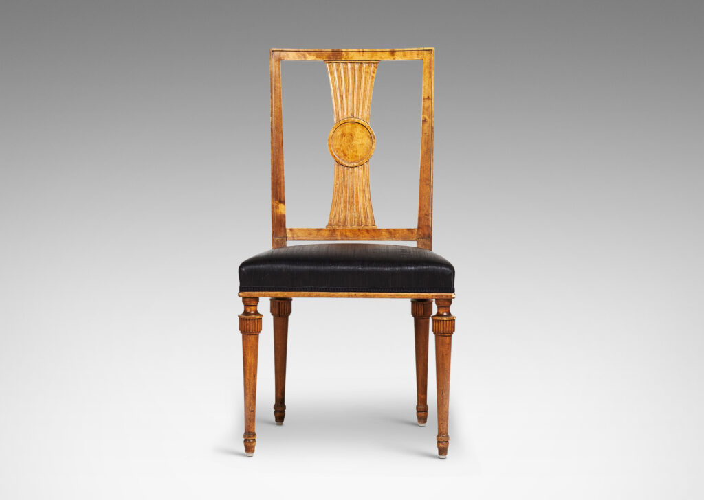 Gallery BAC squared backs with splats ornamented with radiating fluting and central disk medallions, and tapered legs with stylized tassel headers