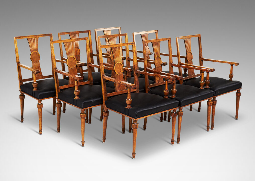 Gallery BAC squared backs with splats ornamented with radiating fluting and central disk medallions, arms with scrolled ends and turned supports, and tapered legs with stylized tassel headers