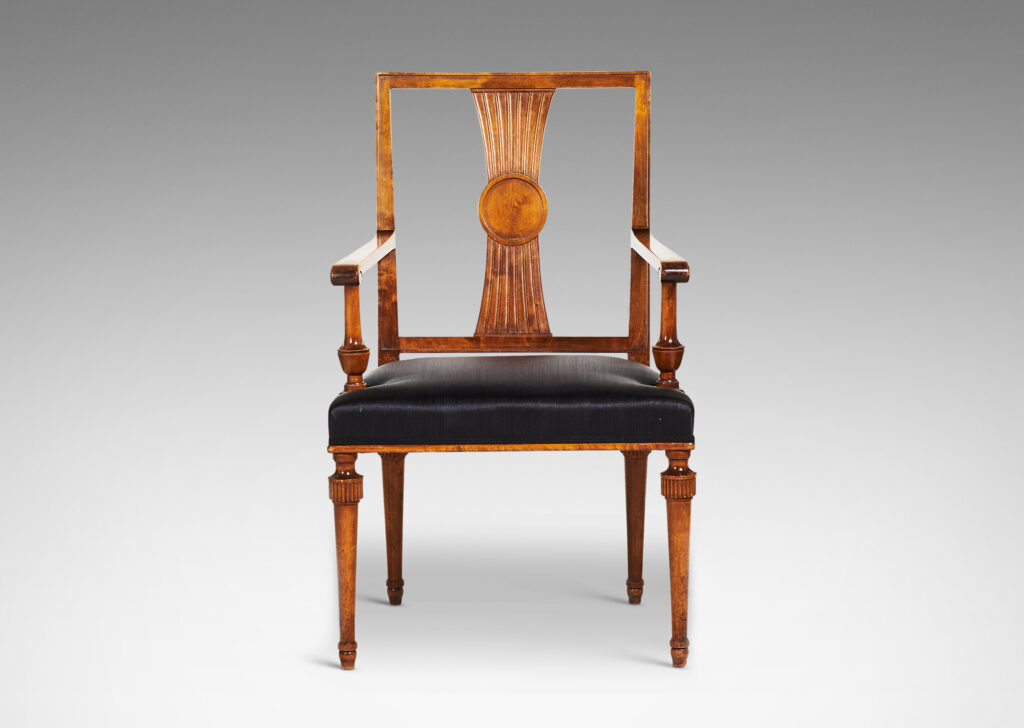 Gallery BAC squared backs with splats ornamented with radiating fluting and central disk medallions, arms with scrolled ends and turned supports, and tapered legs with stylized tassel headers