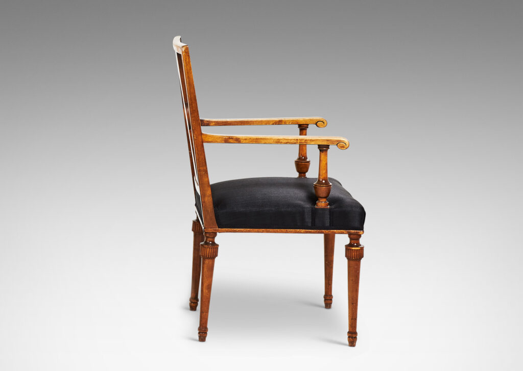 Gallery BAC squared backs with splats ornamented with radiating fluting and central disk medallions, arms with scrolled ends and turned supports, and tapered legs with stylized tassel headers