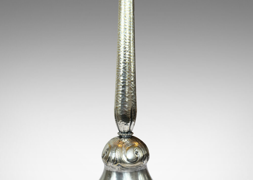 Gallery BAC swelling stand and pillowy flared base with repousse hammered texture, and scrolling acanthus leaf ornamentation