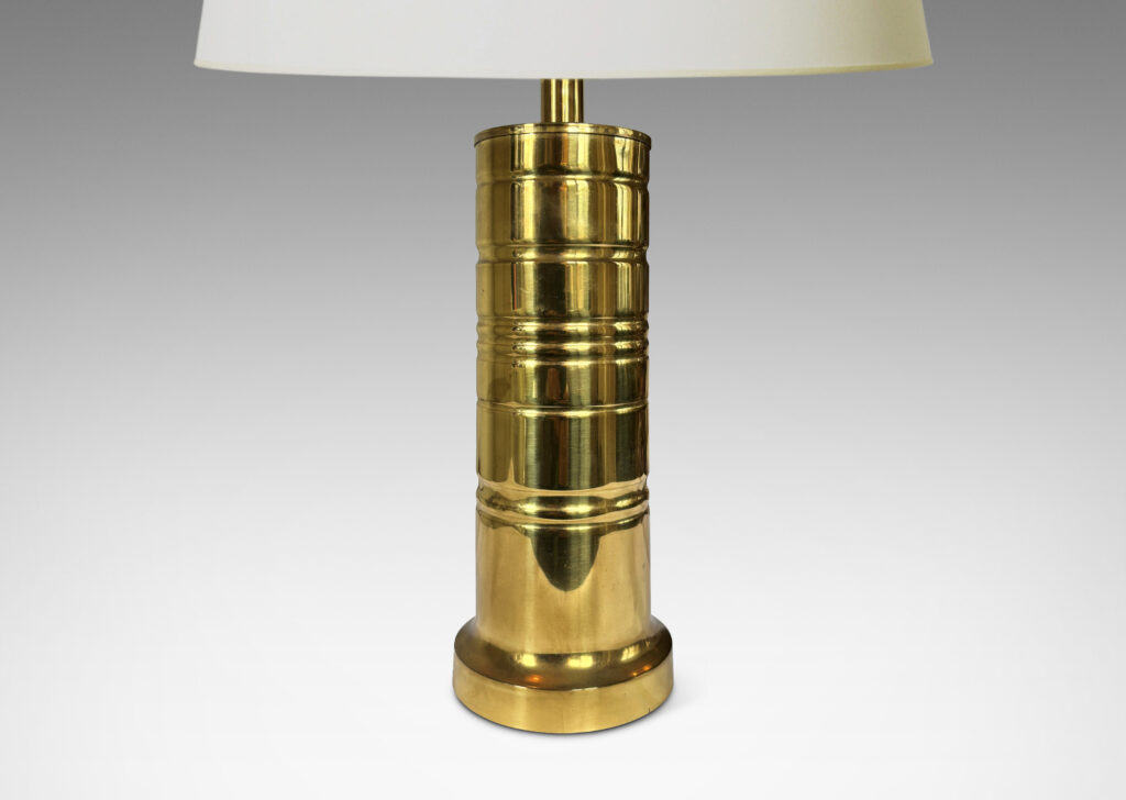 Gallery BAC cylindrical forms with articulated bases and embossed ring details; brass
