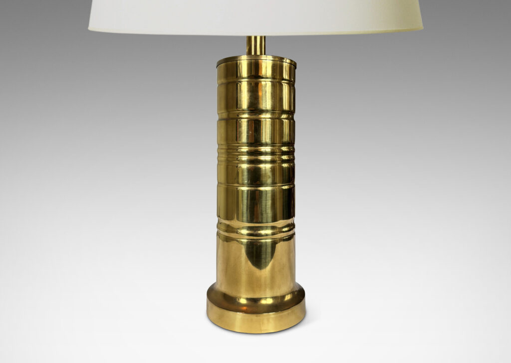 Gallery BAC cylindrical forms with articulated bases and embossed ring details; brass
