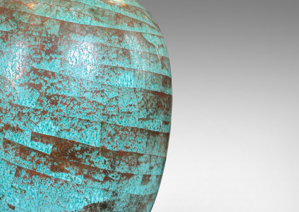 Gallery BAC ovoid form glazed in a marvelous celadon green-red luster with spiraling craquelure