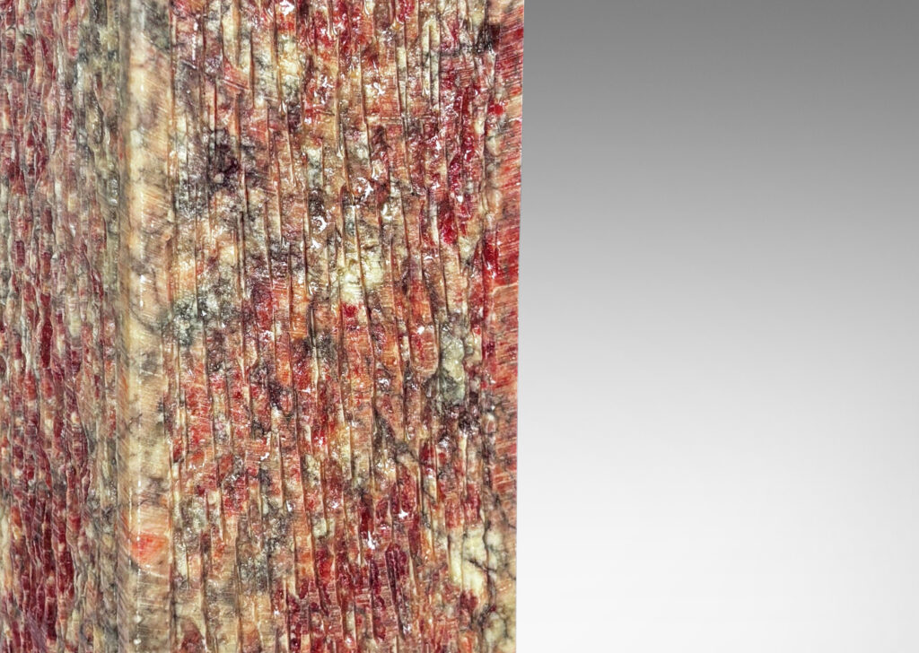 Gallery BAC square pillar forms with carved surface texture in red and gray marble, with cylindrical necks in white marble