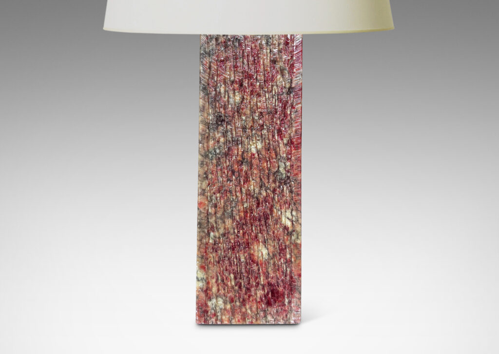 Gallery BAC square pillar forms with carved surface texture in red and gray marble, with cylindrical necks in white marble