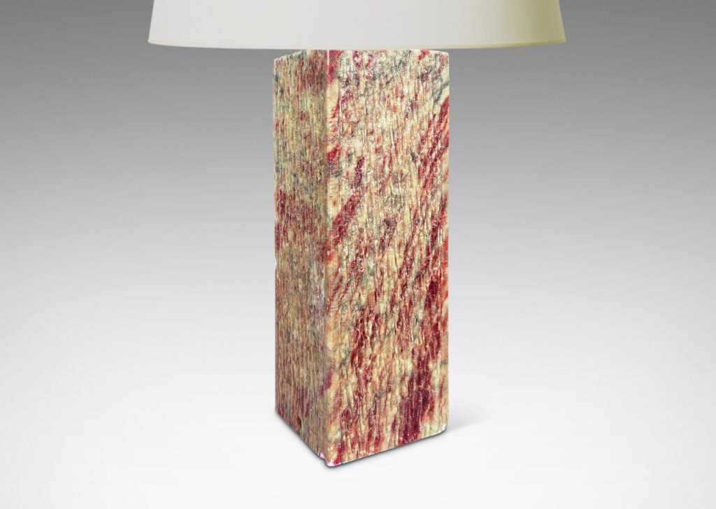 Gallery BAC square pillar forms with carved surface texture in red and gray marble, with cylindrical necks in white marble