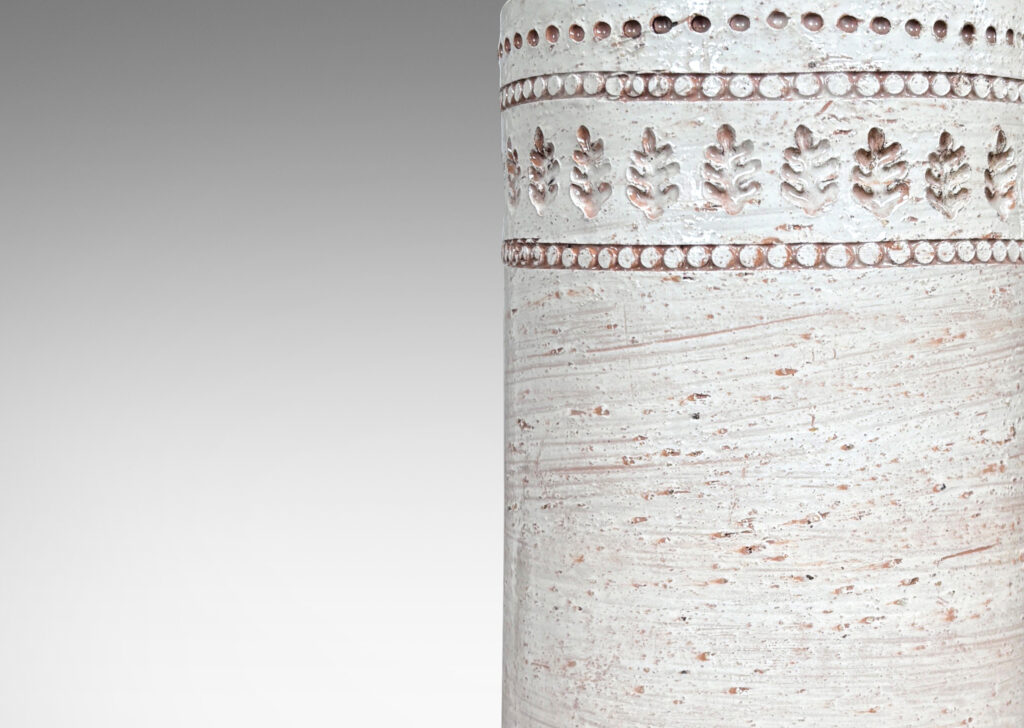 Gallery BAC textured column forms with bands of impressed dots and leaf motifs, glazed in shaded ivory