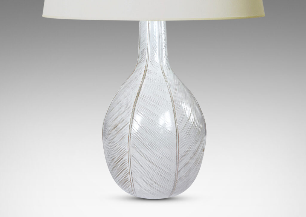 Gallery BAC gourd/drop form finished with carved meridians of herringbone textures and a semi-shiny off-white glaze