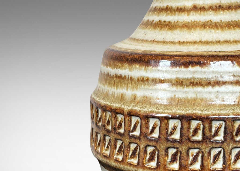 Gallery BAC textured bulbous forms and tall conical necks, glazed in brown and gray-brown