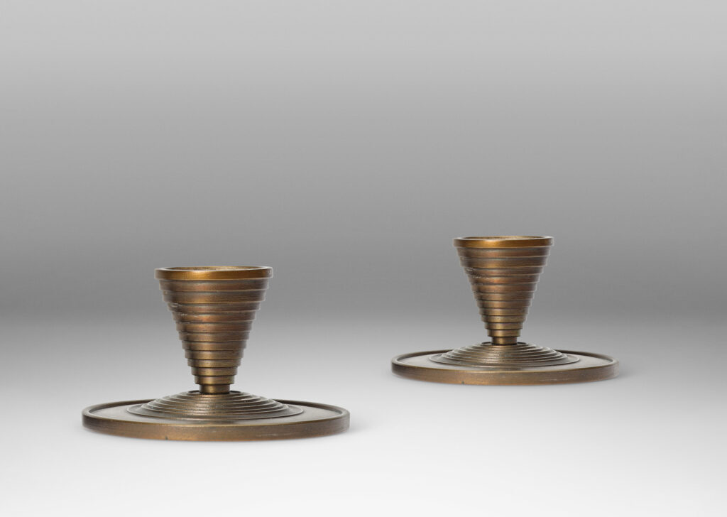 Gallery BAC stepped tapered form on stepped disk plinths; patinated bronze