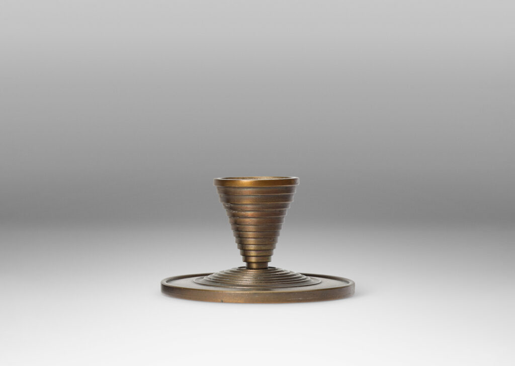 Gallery BAC stepped tapered form on stepped disk plinths; patinated bronze