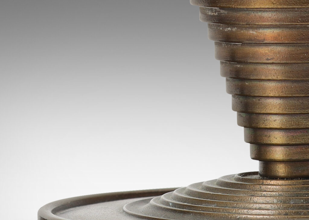 Gallery BAC stepped tapered form on stepped disk plinths; patinated bronze