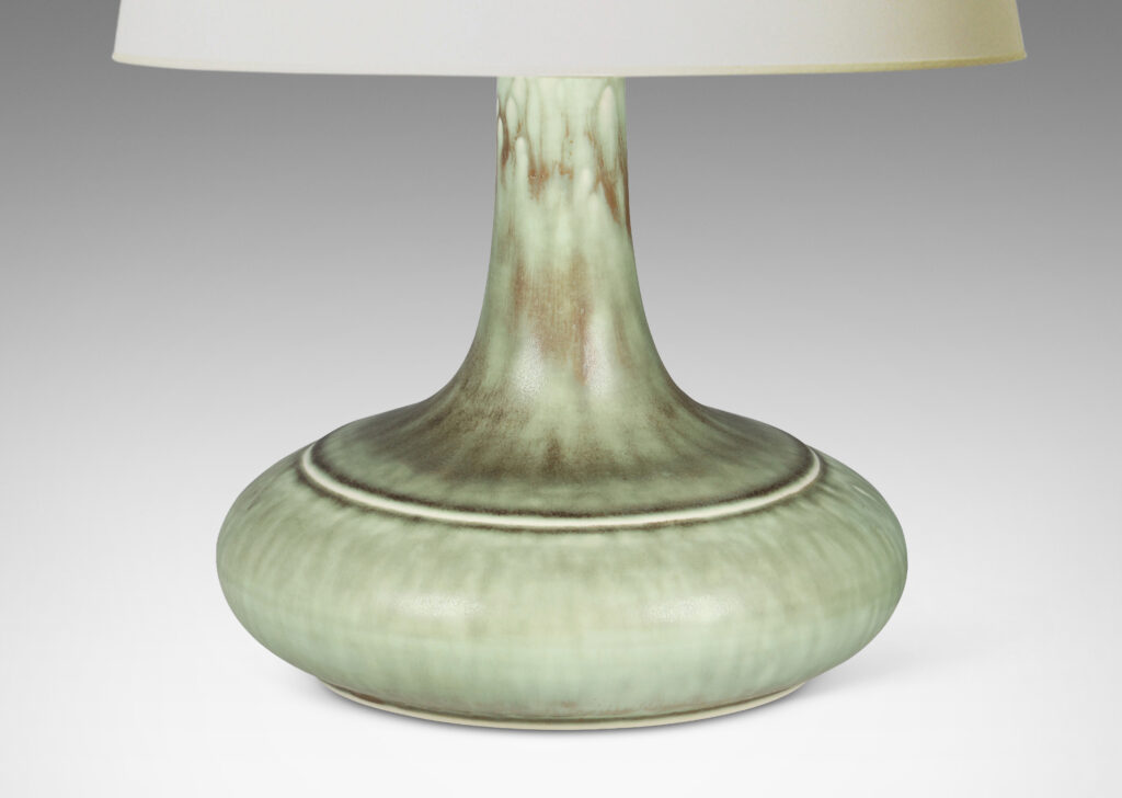 Gallery BAC decanter-like form with a wide compressed base and sprouting neck; glazed in a flowing blue-green and gray