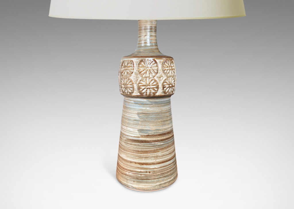 Gallery BAC tapered column forms capped with rosette motifs, glazed in a striae brown over tan