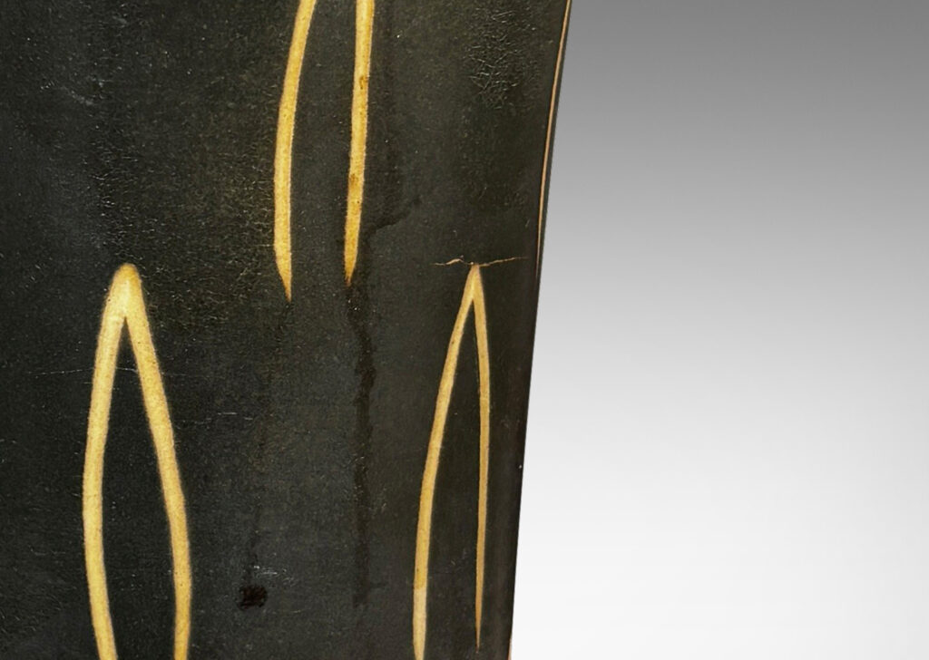 Gallery BAC gently trumpeting form glazed dark brown, with sgraffito leaf motifs