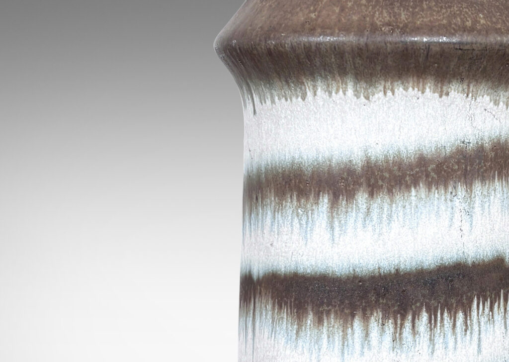 Gallery BAC cylindrical form with a sloping cap, glazed in matte white and brown with spiraling design