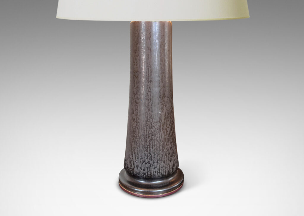 Gallery BAC coved cylindrical form on a disk plinth, finished in a handsome deep brown harefur glaze