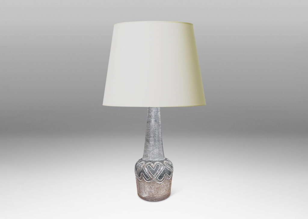 Gallery BAC tapered drum form with carved band of alternating heart motifs, and tall ridged conical neck, glazed in matte dark and light browns