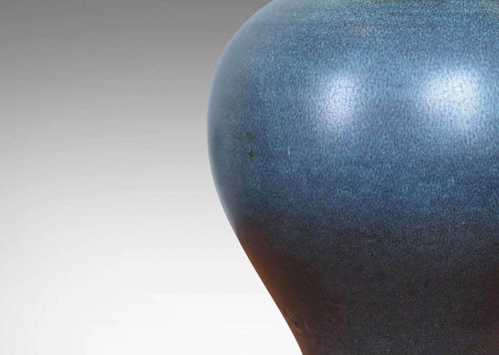 Gallery BAC swelling tapered form glazed in a deep blue with subtle harefur texture