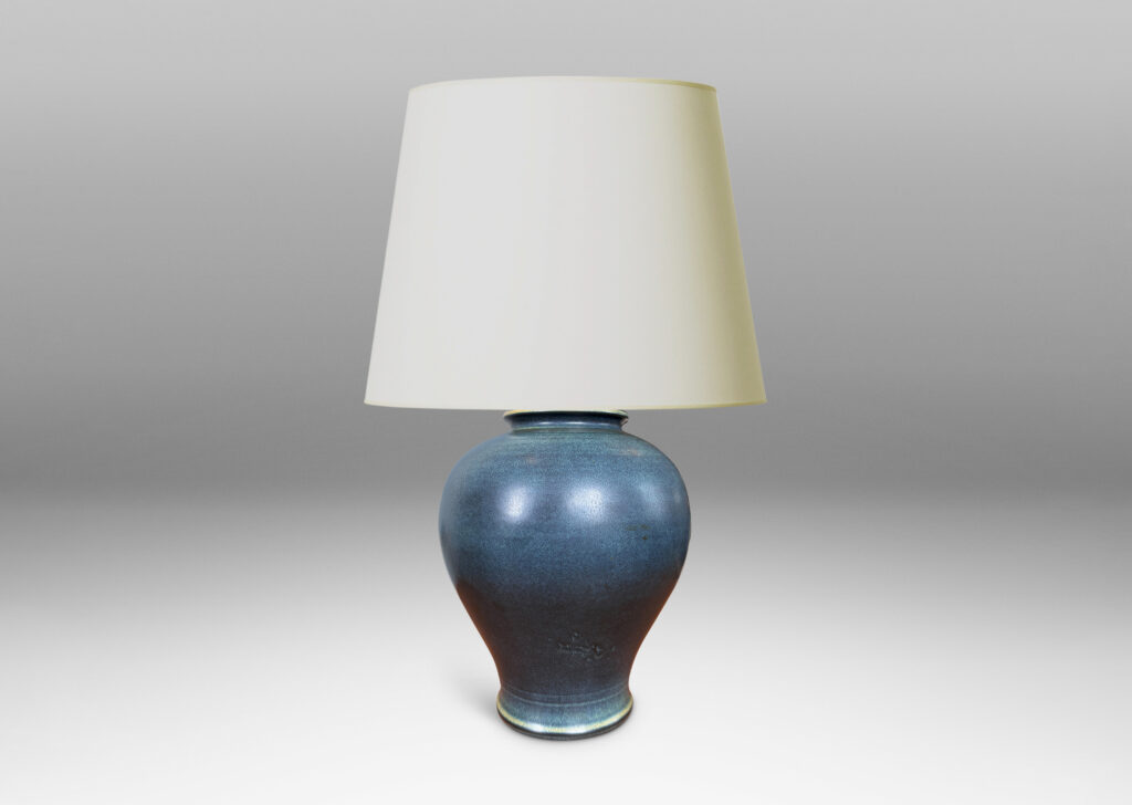 Gallery BAC swelling tapered form glazed in a deep blue with subtle harefur texture