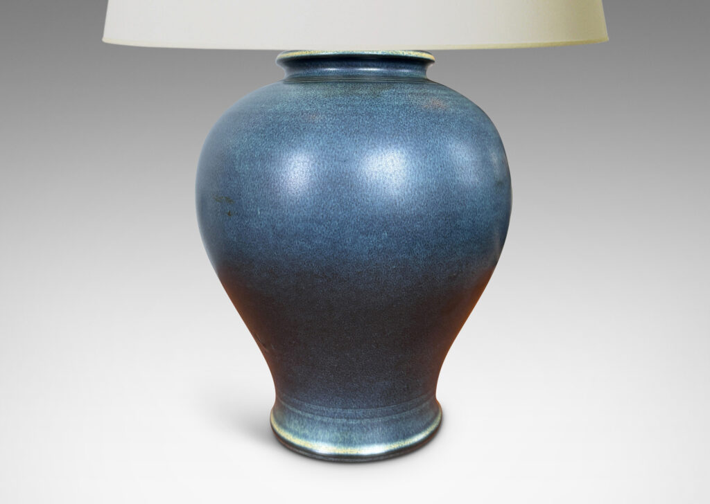 Gallery BAC swelling tapered form glazed in a deep blue with subtle harefur texture