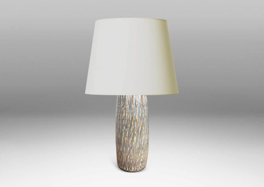 Gallery BAC swelling cylindrical form with carved gouged surface and flowing brown glaze